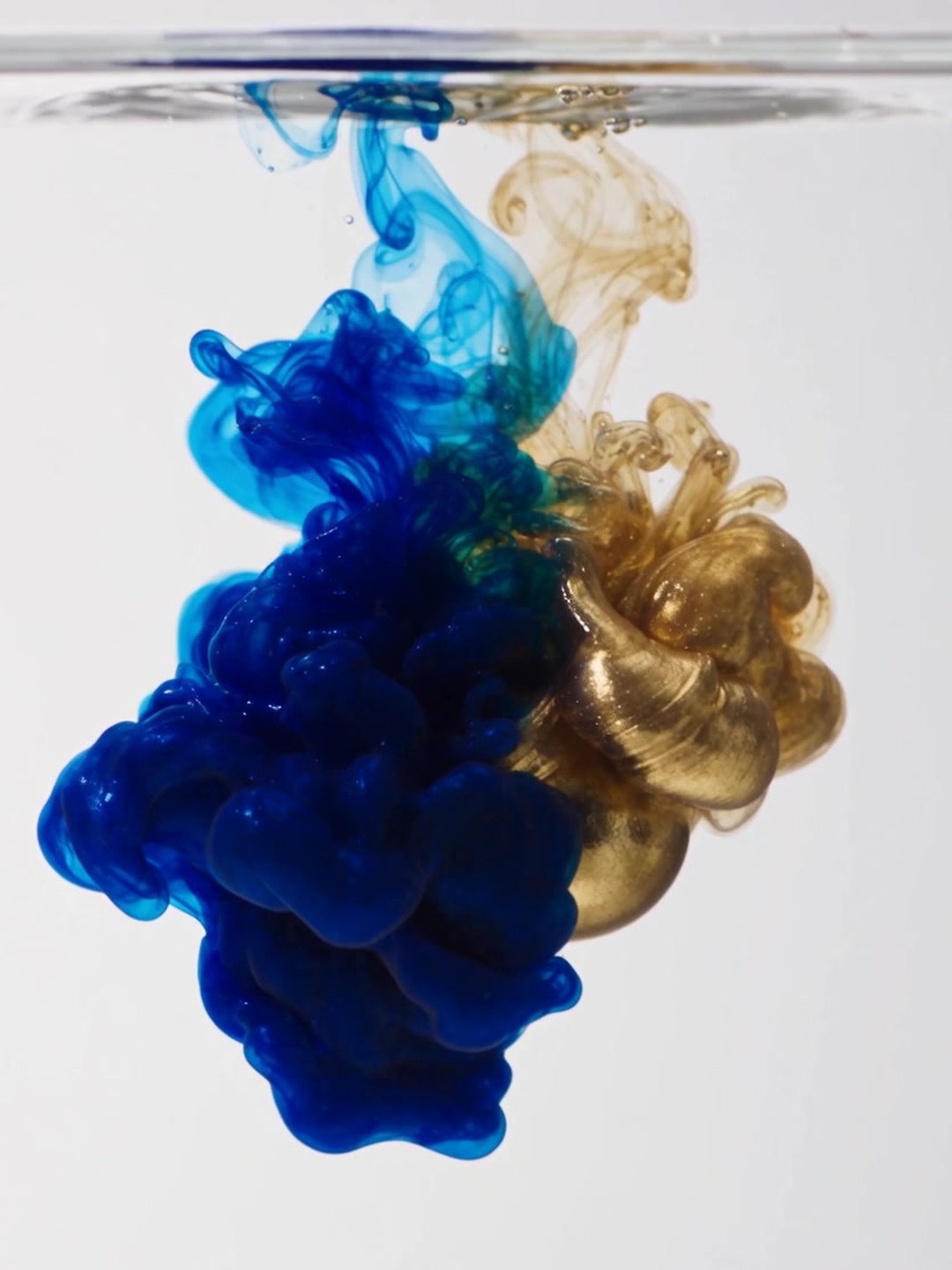 Blue and gold ink in water AI prompt example
